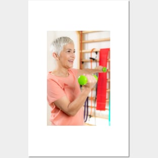 Senior woman exercising with dumbbells (F024/9971) Posters and Art